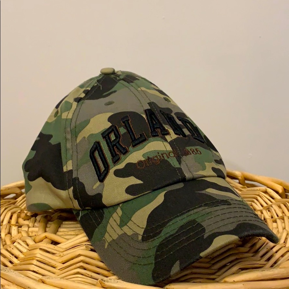 A camouflage baseball cap